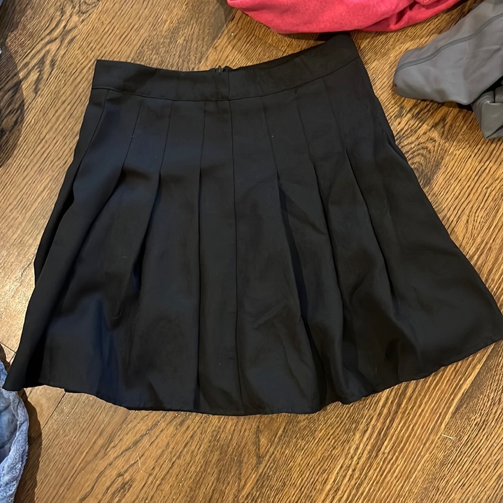 black pleated skirt
